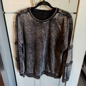 Oversized "Worn" black sweatshirt with ruffle trim